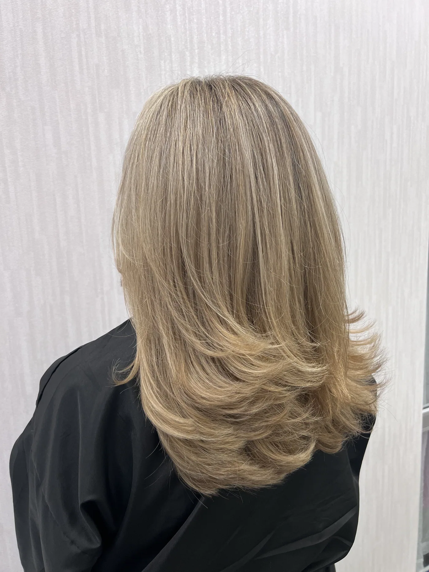 Long blonde balayage with soft layers at The Beauty of Zen, Worcester MA