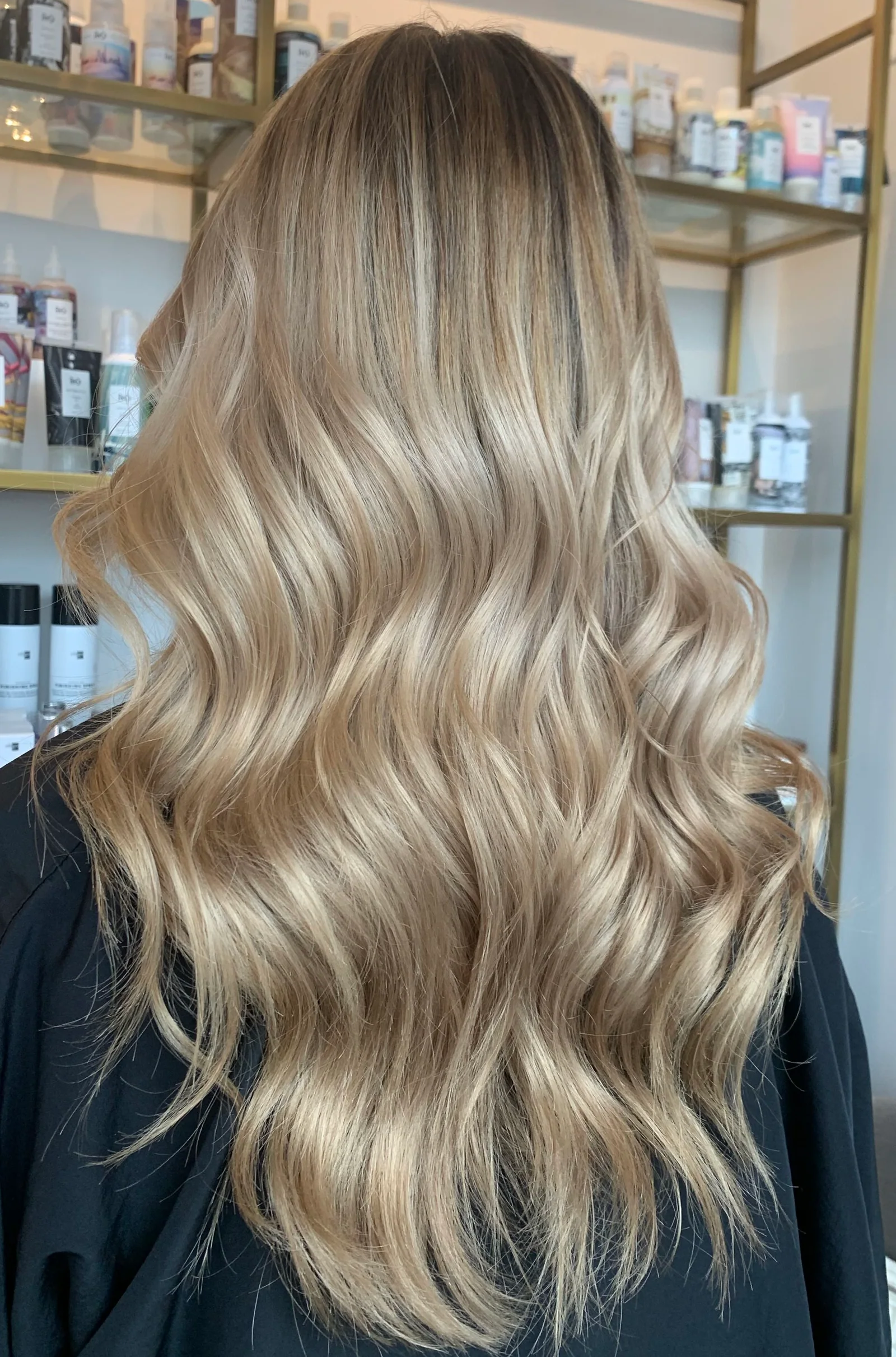 Long blonde balayage with soft layers and natural highlights by Shannon Ortiz at The Beauty of Zen organic salon, Worcester MA