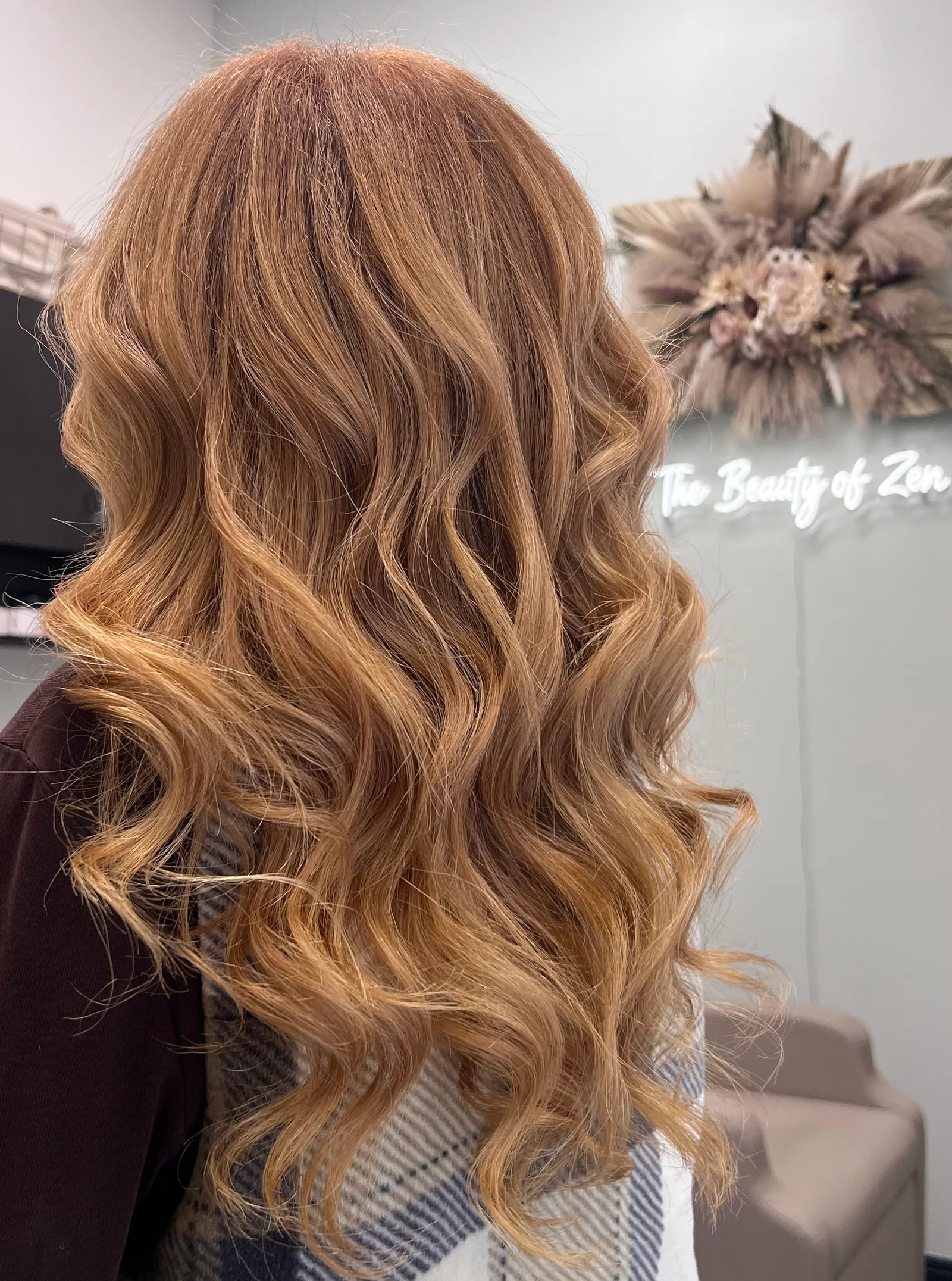 Warm copper blonde balayage with soft waves at The Beauty of Zen organic salon, Worcester MA